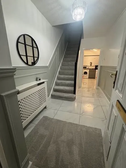 Wall panelling along a hallway and staircase. Photo 3 of 5.