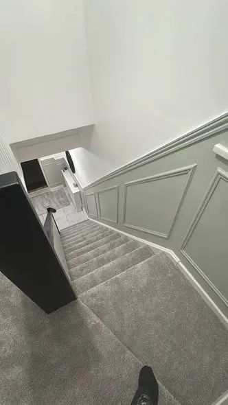 Wall panelling along a hallway and staircase. Photo 5 of 5.